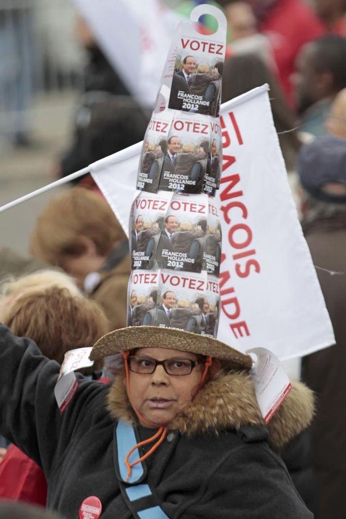 A supporter of Francois Hollande, Socialist Party candidate for the 2012 French presidential election, wears a home-made hat as she attends a campaign rally near the Chateau de Vincennes in Paris