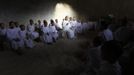 A Buddhist nun speaks with novice Thai nuns at the Sathira Dammasathan Buddhist meditation centre in Bangkok