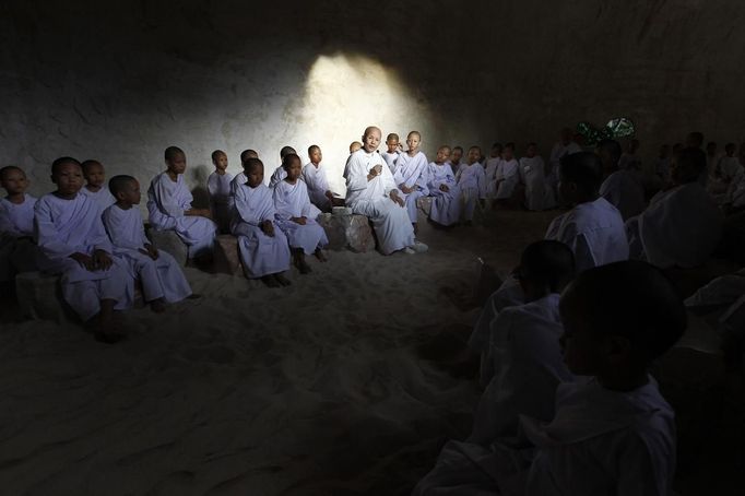 A Buddhist nun speaks with novice Thai nuns at the Sathira Dammasathan Buddhist meditation centre in Bangkok