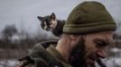 A cat sits on the shoulder of Ukrainian serviceman Mykyta of the 93rd separate mechanized brigade at a rest house near the front line in the Donetsk region, amid Russia’s