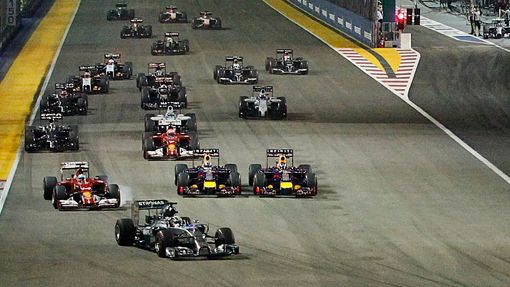 Mercedes Formula One driver Lewis Hamilton (front) of Britain leads the pack as team mate Nico Rosberg (top, R) of Germany starts from the pit lane following problems wit