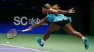 Serena Williams of the U.S. hits a return to Caroline Wozniacki of Denmark during their WTA Finals singles semi-final tennis match at the Singapore Indoor Stadium October