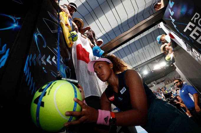 Tennis - Australian Open - Second Round - Melbourne Park, Melbourne, Australia, January 17, 2019. Japan's Naomi Osaka signs autographs after winning the match against Slo