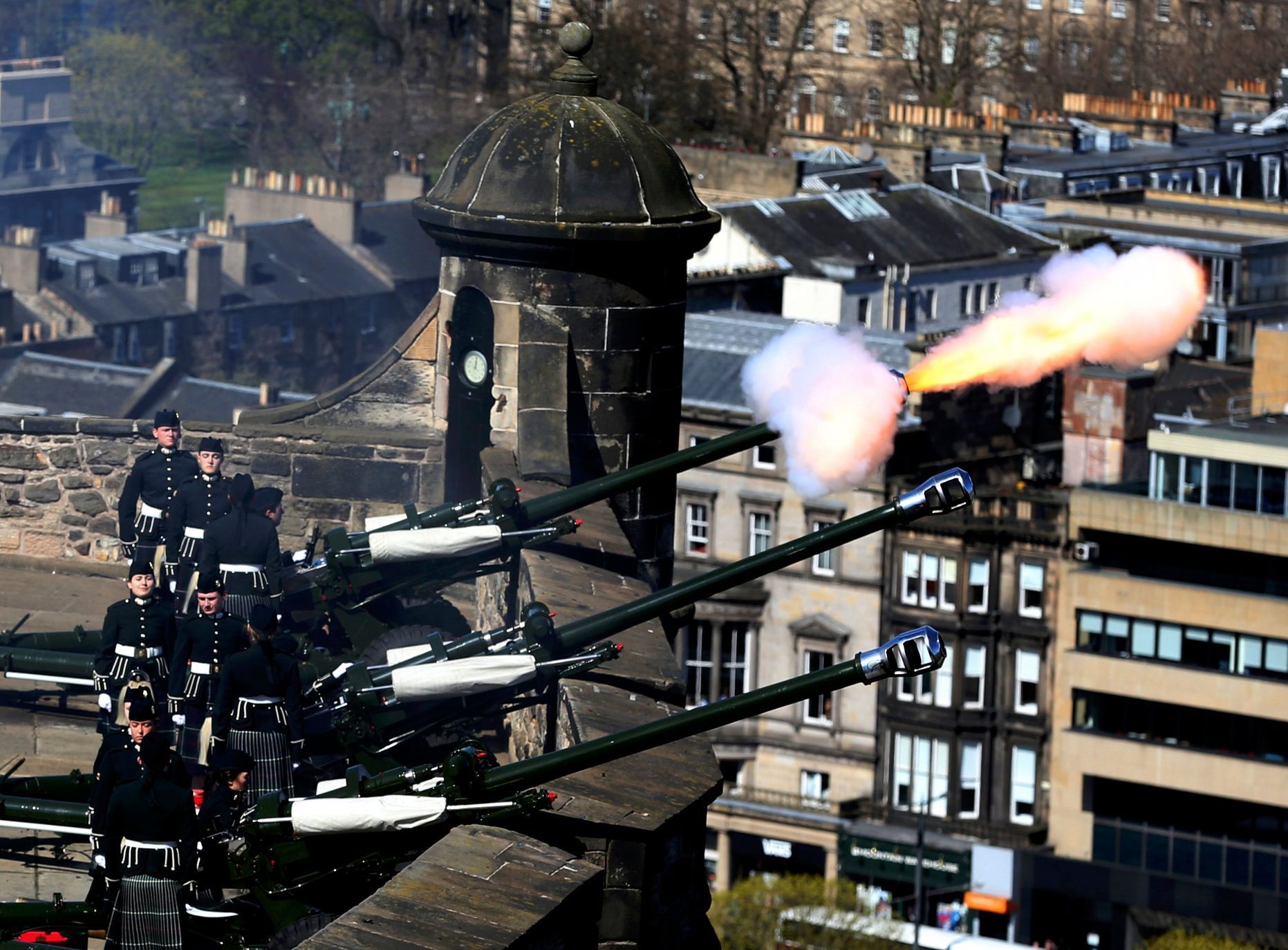Gunners fire a twenty-one gun salute in honour of Britain's Queen Elizabeth 90th birthday celebrations at Mills Mount Battery at Edinburgh Castle in Scotland