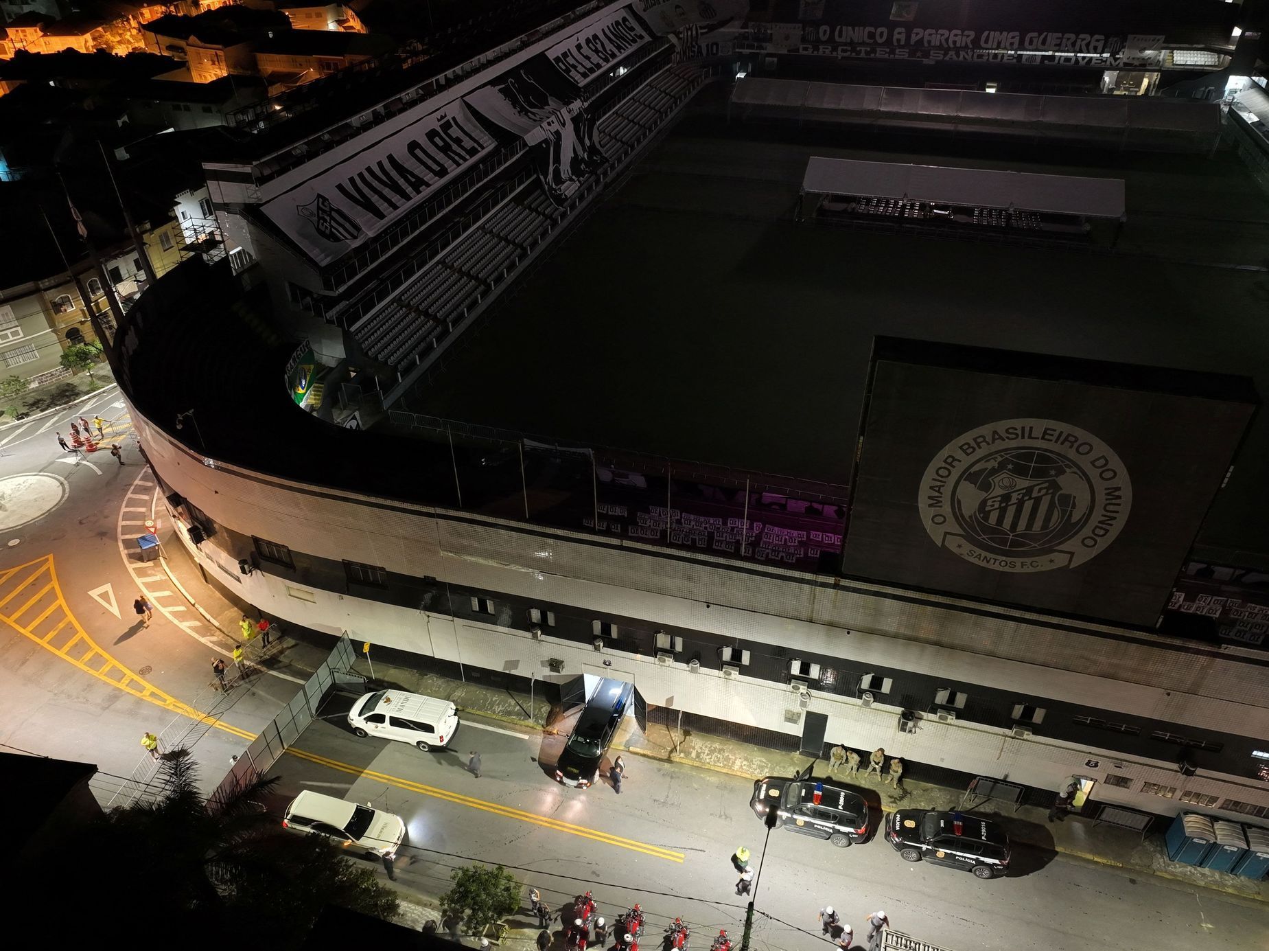 A hearse carrying the body of Brazilian soccer legend Pele arrives at the Vila Belmiro stadium in Santos