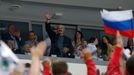 Belarus President Alexander Lukashenko (C) waves as he arrives to watch the men's ice hockey World Championship final game between Finland and Russia at Minsk Arena in Mi