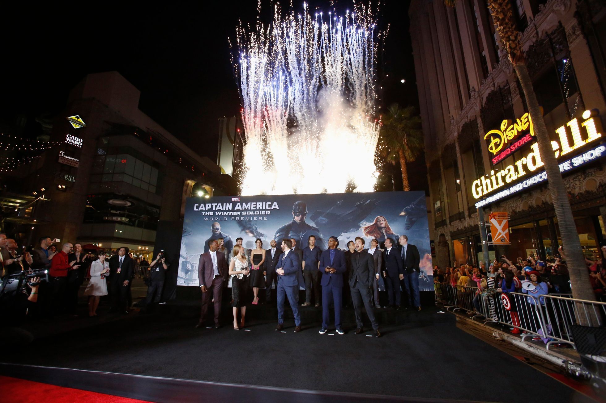 Firecrackers are set off as the cast poses at the premiere of &quot;Captain America: The Winter Soldier&quot; in Hollywood