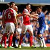 Arsenal's Gabriel Paulista clashes with Chelsea's Oscar after being sent off